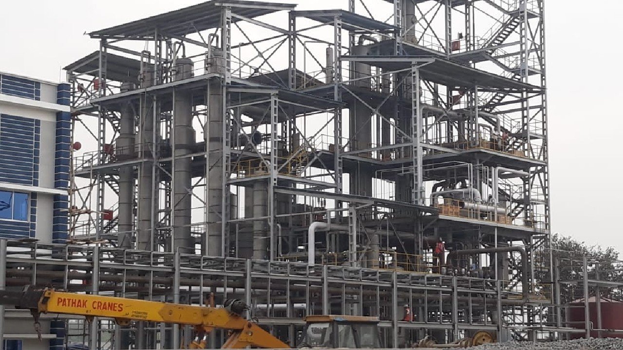 Ethanol plant civil construction site with distillation structure and process piping